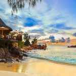 Cafe on tropical beach at sunset