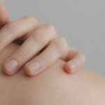 close-up-photo-of-person-touching-their-shoulder-1727200