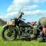 Old military motorcycle in landscape