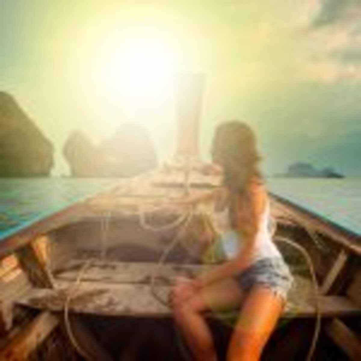 woman-wearing-white-tank-top-seating-on-boat-1006339