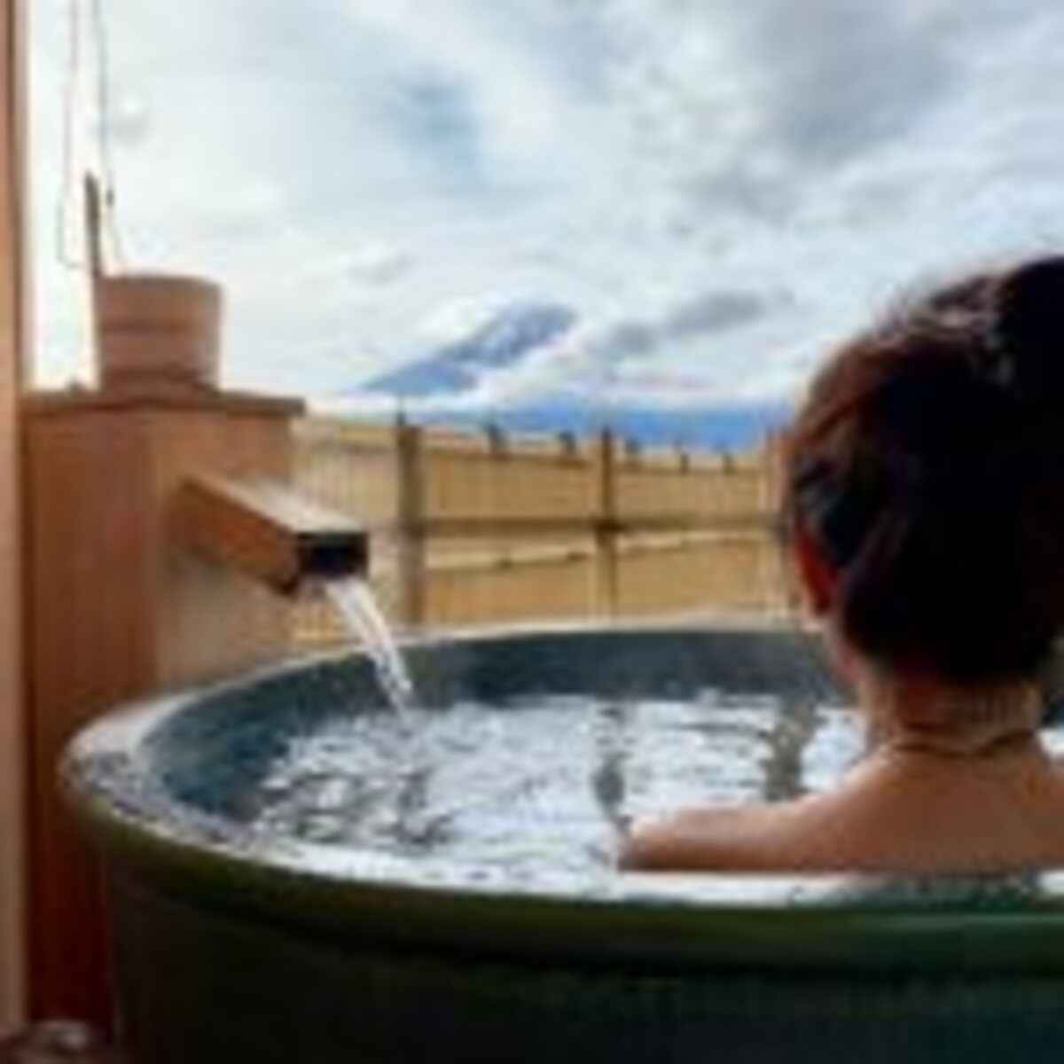 Beautiful,Girl,Sitting,In,Onsen,(mineral,Hot,Bath),And,Seeing