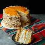 Uruguayan cake chaja: the famous sponge cake from Uruguay,  sponge cake stuffed with syrup, dulce de leche, whipped cream and peaches.