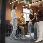 full-shot-people-discussing-work