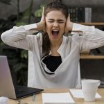 businesswoman-looking-angry-while-working-from-home