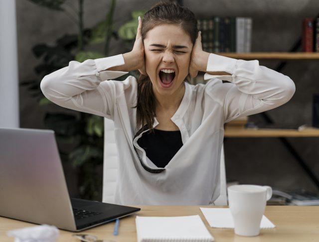 businesswoman-looking-angry-while-working-from-home