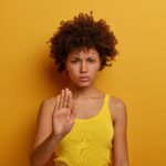 beautiful-serious-young-woman-demands-hold-makes-prohibition (1)