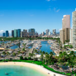 Look from above at skyscrapers standing over the sea and bays