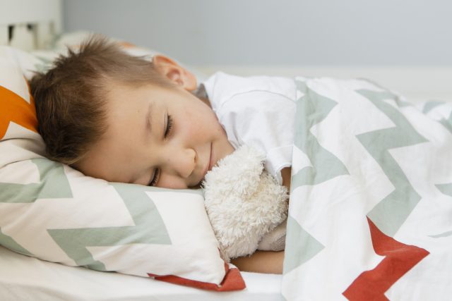 boy-sleeping-with-his-favorite-toy