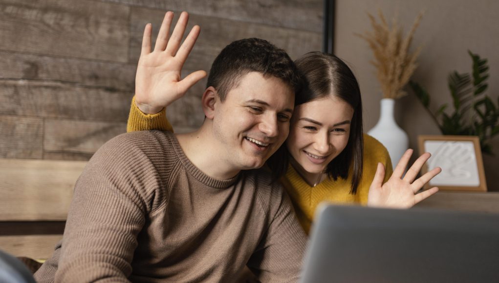 medium-shot-people-waving-laptop