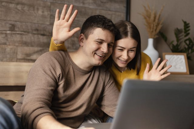 medium-shot-people-waving-laptop