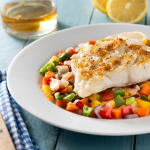 grilled-cod-with-vegetables-blue-wooden-table