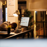 tired-drained-entrepreneur-sleeping-desk-startup-office