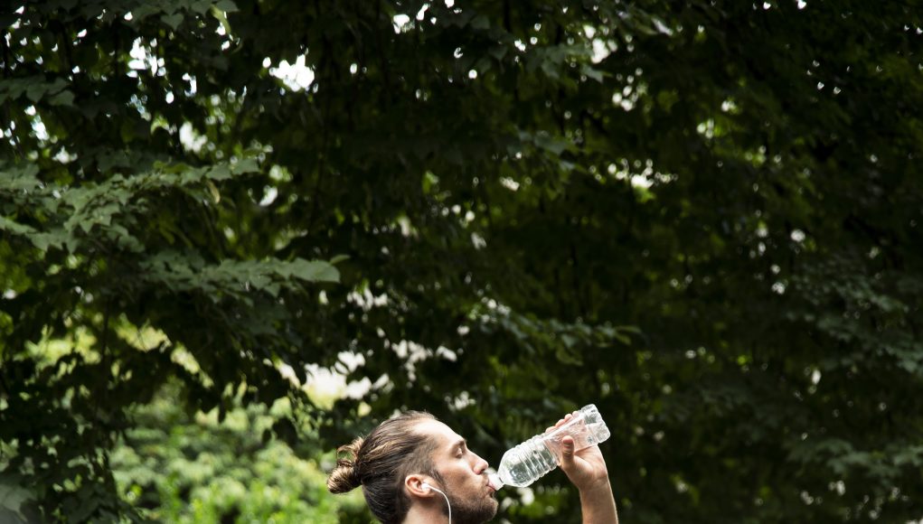 full-shot-runner-drinking-water