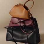 PULE1372_LEATHERGOOD_SOCIAL_STATIC_STILL_LIFE_TOTE_CLOSE_UP_GM_BLACK_MM_BURGUNDY_PM_CARAMEL_30x24