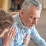 Geriatric physician taking care of a sad ill patient