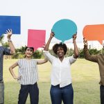 Diverse friends holding speech bubbles