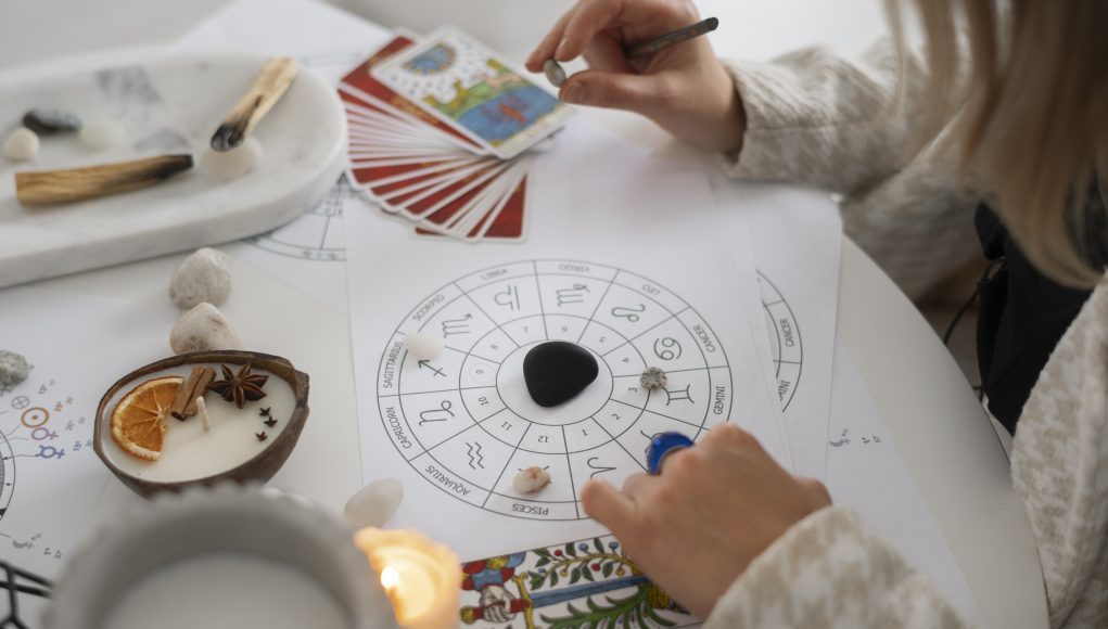 high-angle-woman-reading-tarot-home