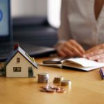 Closeup shot of a person thinking of buying or selling a house